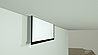 מסך הקרנה חשמלי נסתר עם מערכת מתיחה צדית LUXI Inceeling Tensioned
